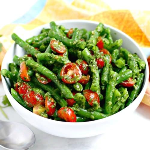 Bowl of green bean and tomato salad.